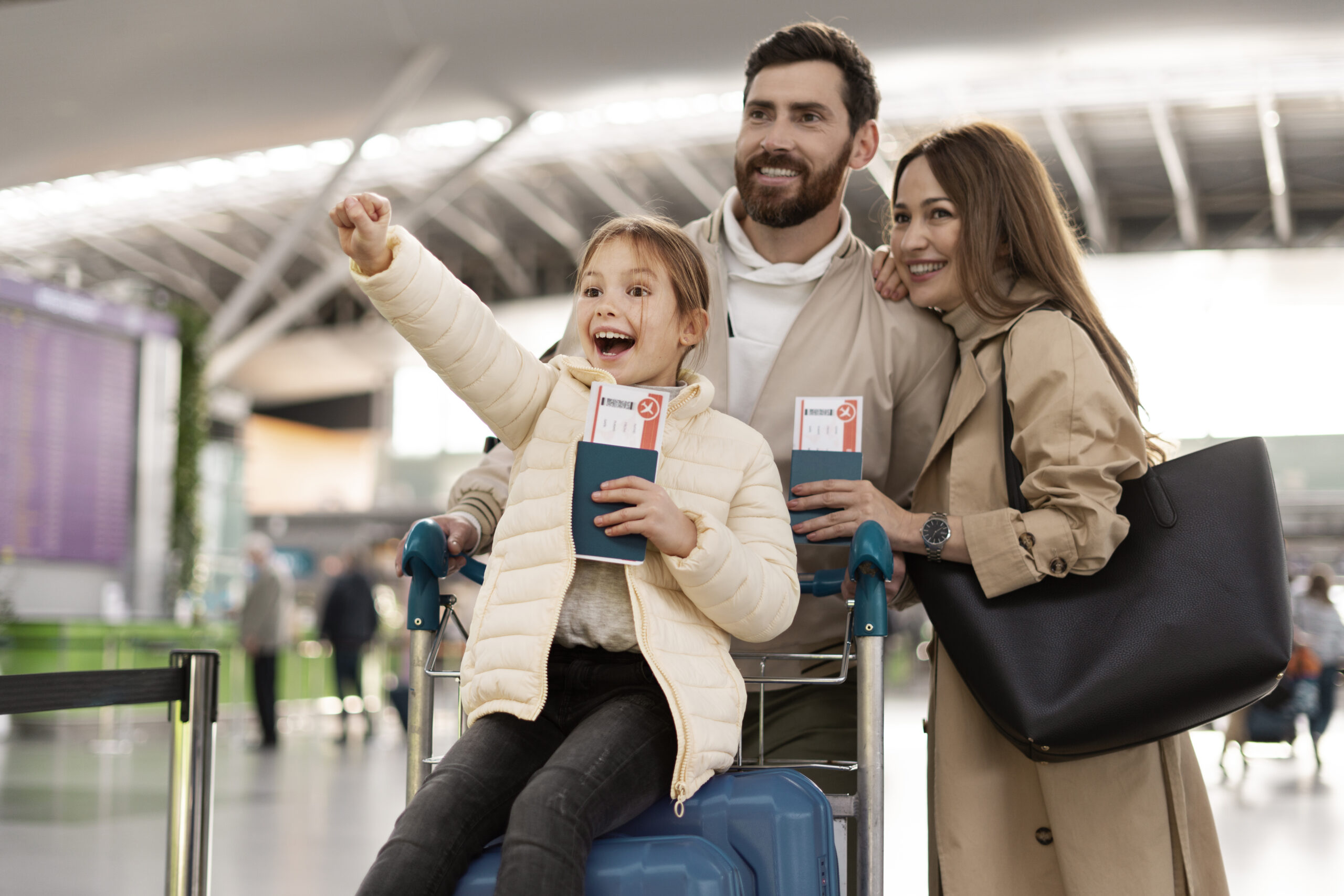 Family of three enjoying their family visa on airport