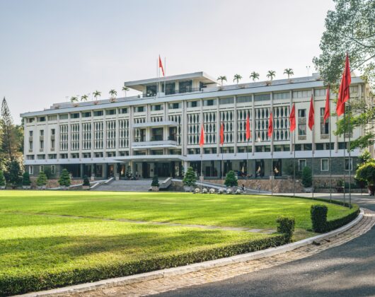 Staffordshire University building with flags in front line and garden