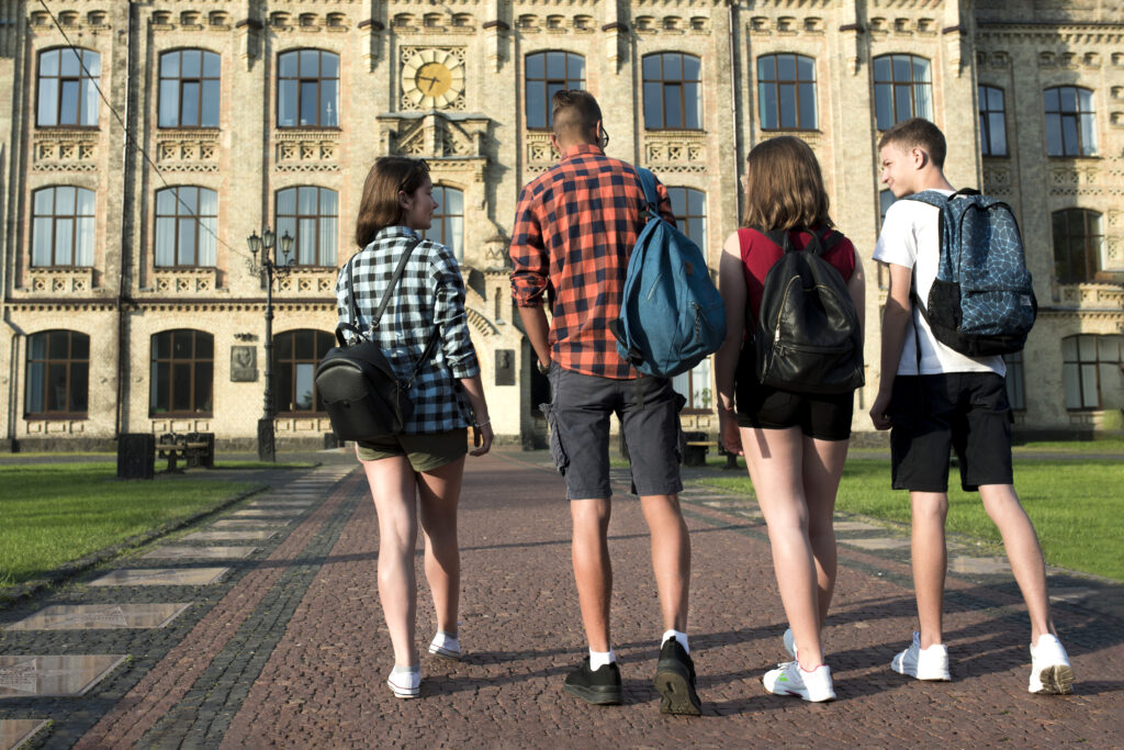 Students walking in front of the university campus