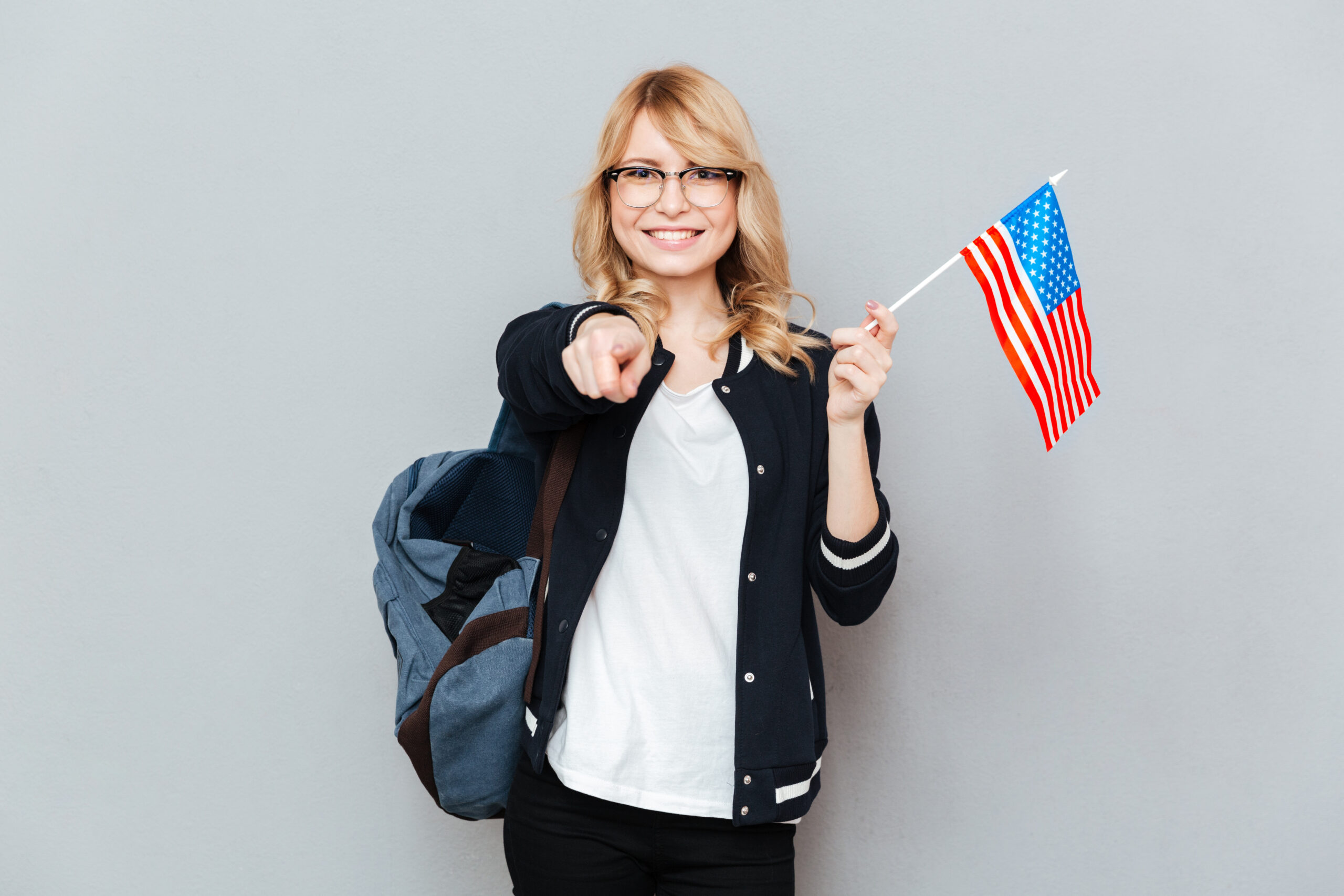 Female student carrying flag of USA