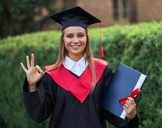 Female graduate student feeling happy