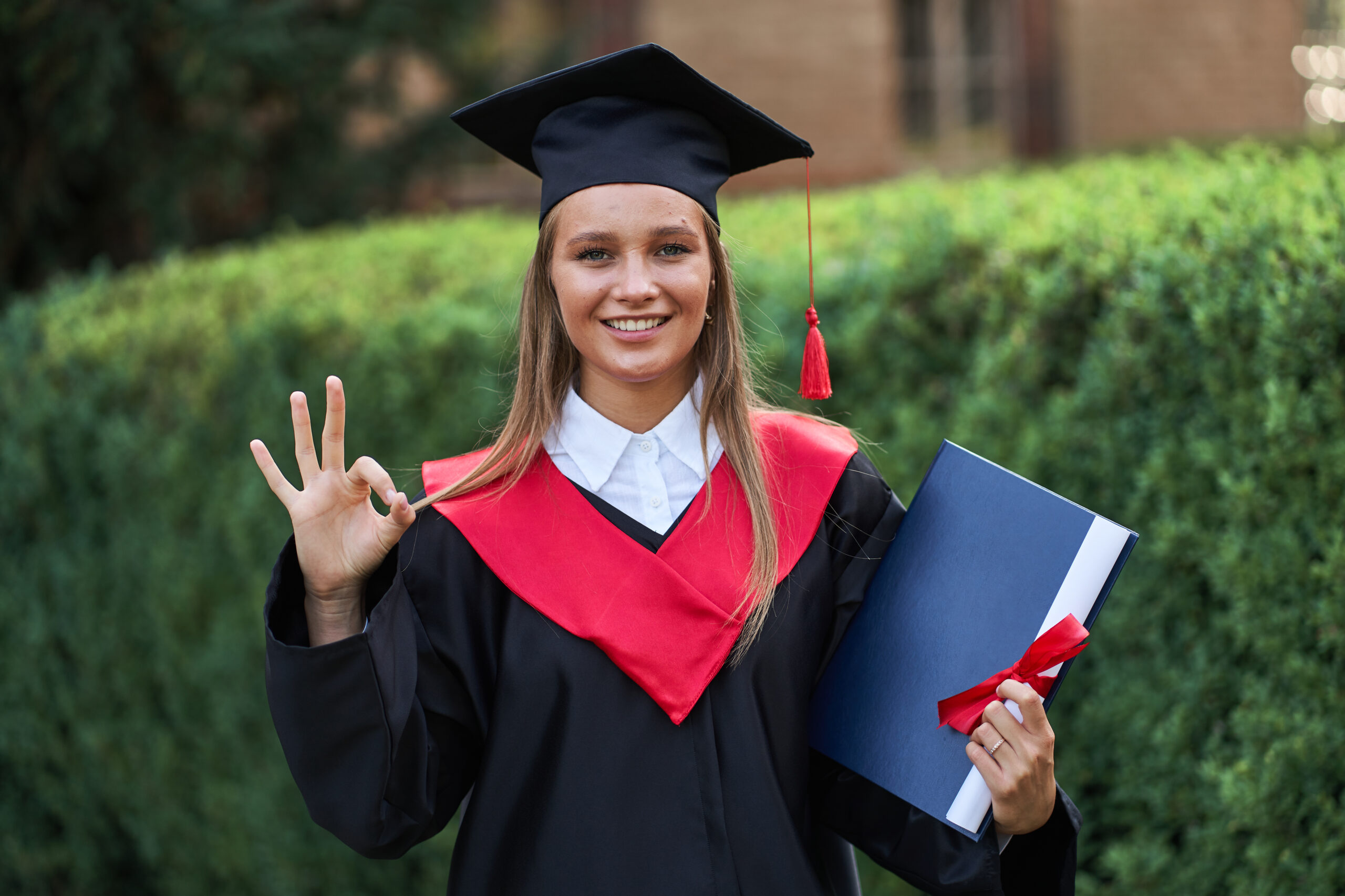 Female graduate student feeling happy