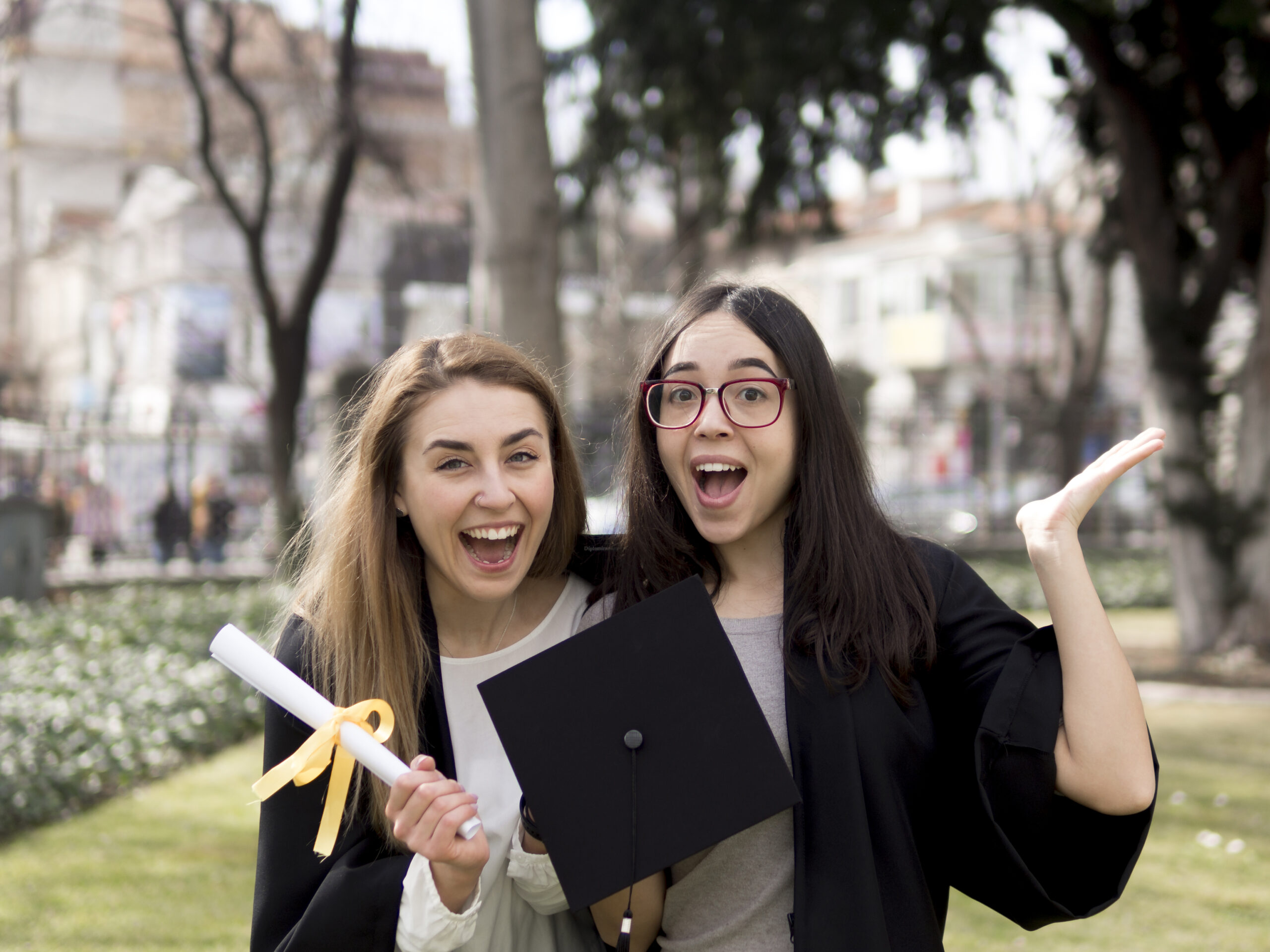 Female students of university feeling happy on their graduation