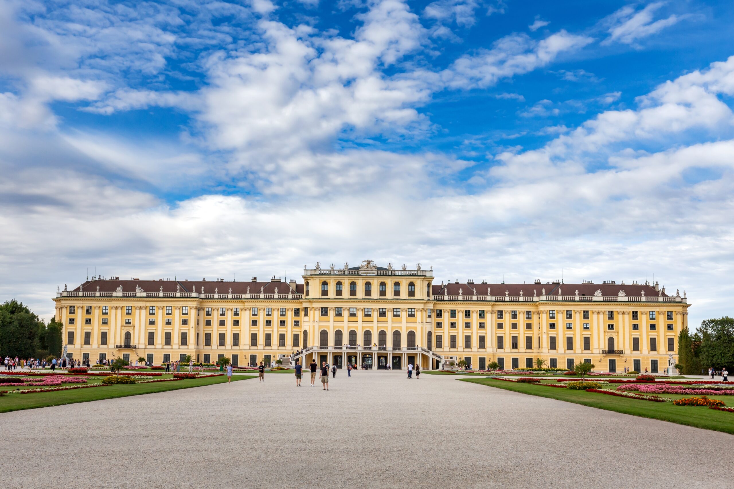 University front view with clouds on sky