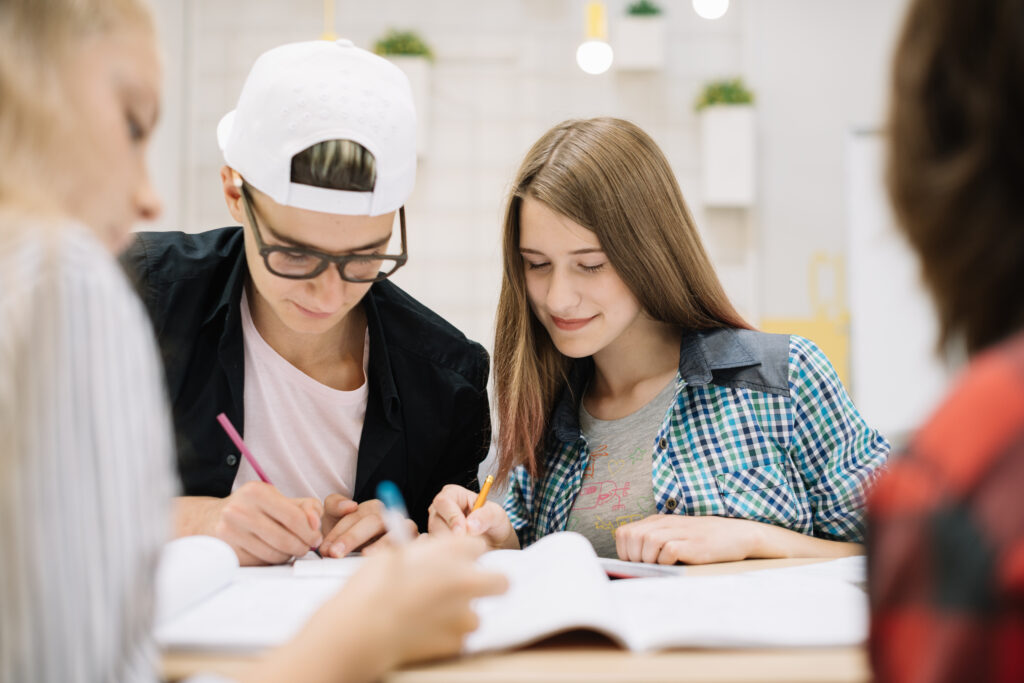 Students writing their personal statement for grad school