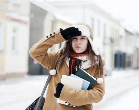 Yound Student carrying books ready for winter intake in Germany