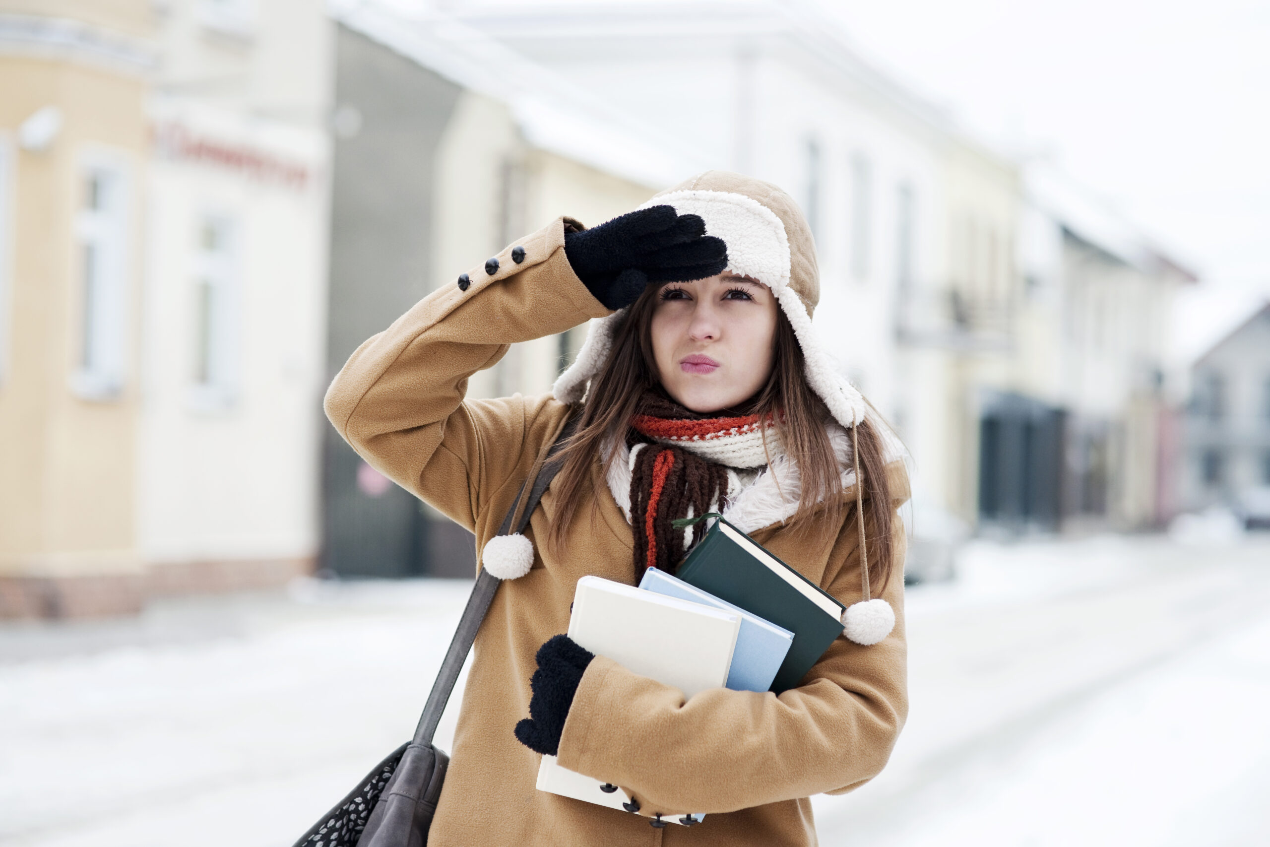 Yound Student carrying books ready for winter intake in Germany