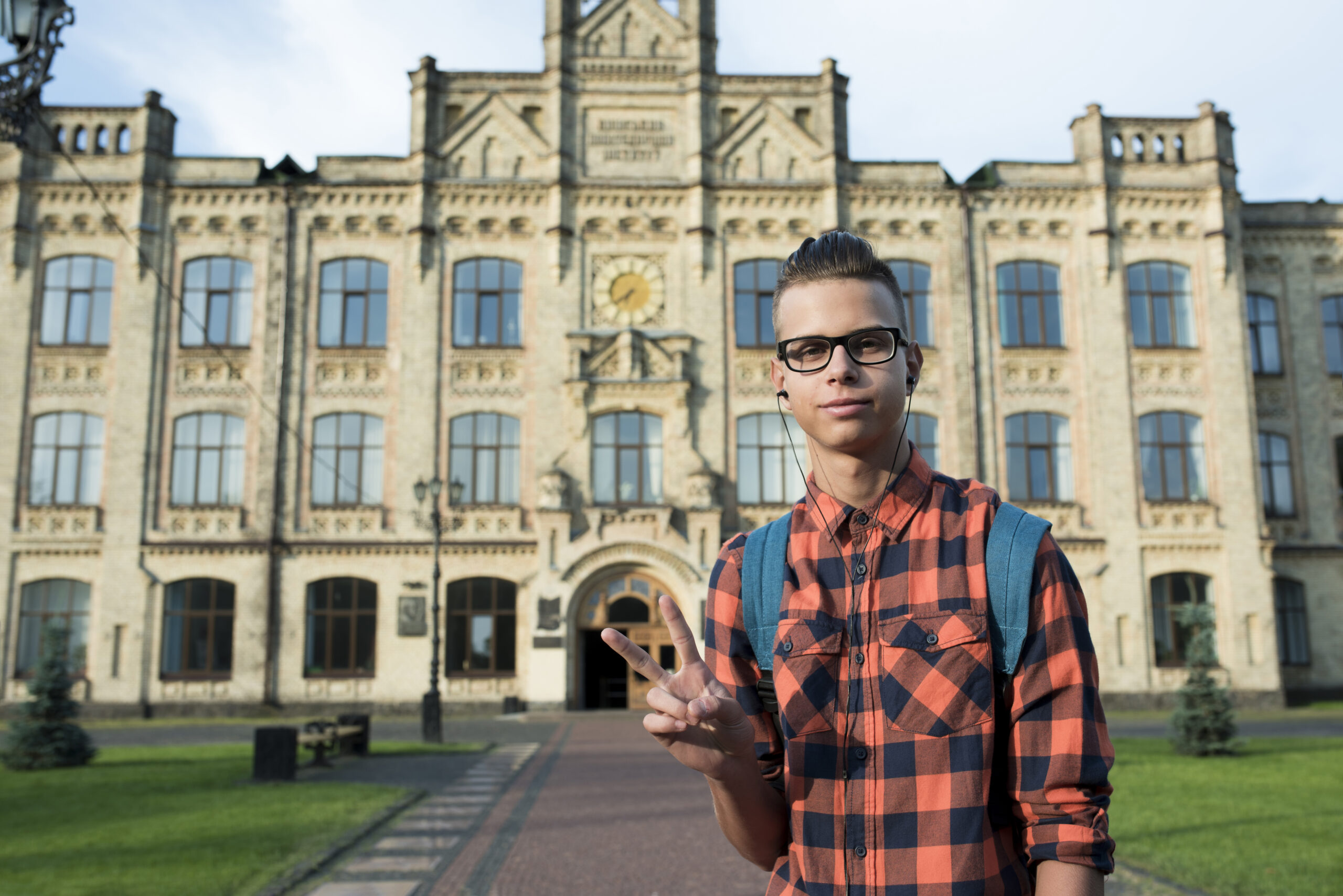 students standing out the university
